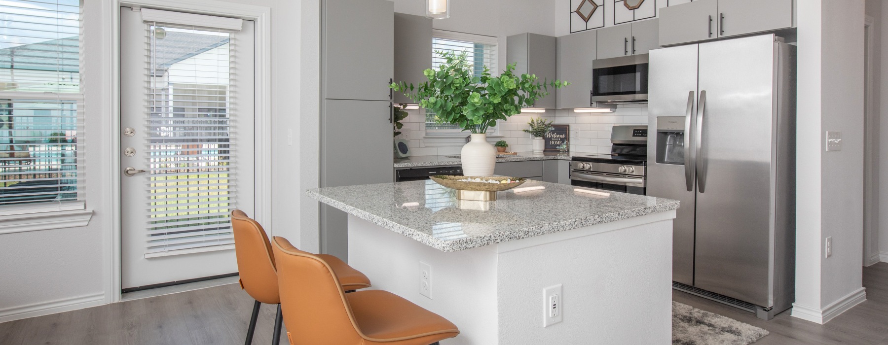 Kitchen and dining space at Arbor Rose Porter's 2 bedroom apartments in Northeast Houston.