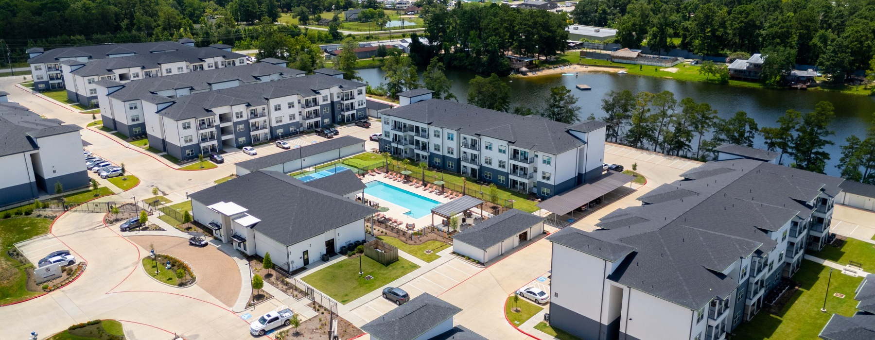 Street-level view of Arbor Rose at Porter leasing office with apartments near Lake Houston.