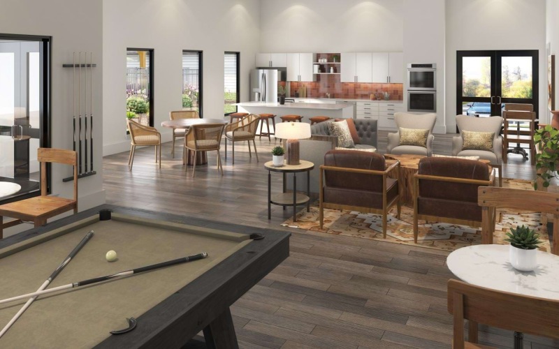 a clubroom with a pool table and chairs
